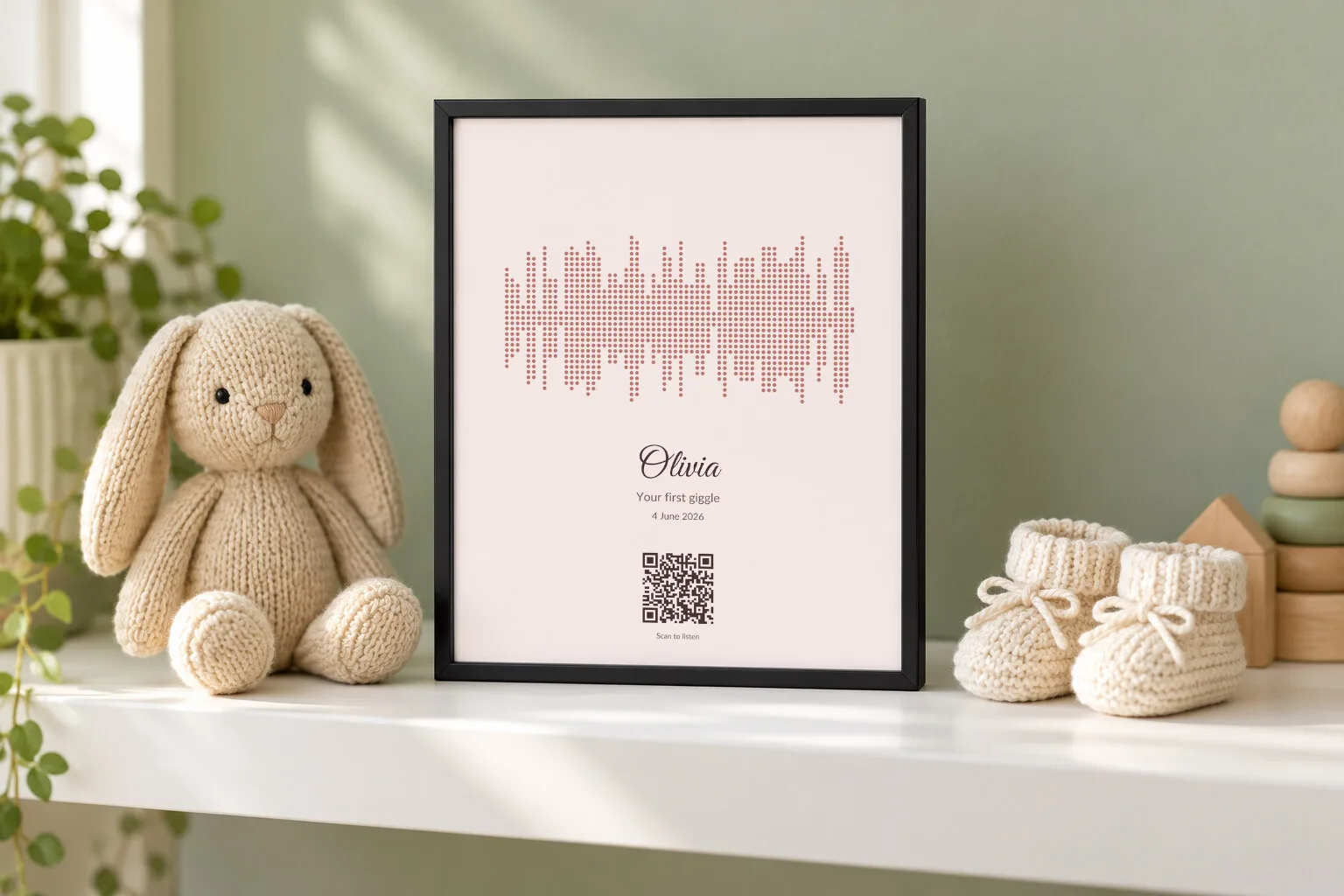 A blush pink voice print for Olivia on a nursery shelf